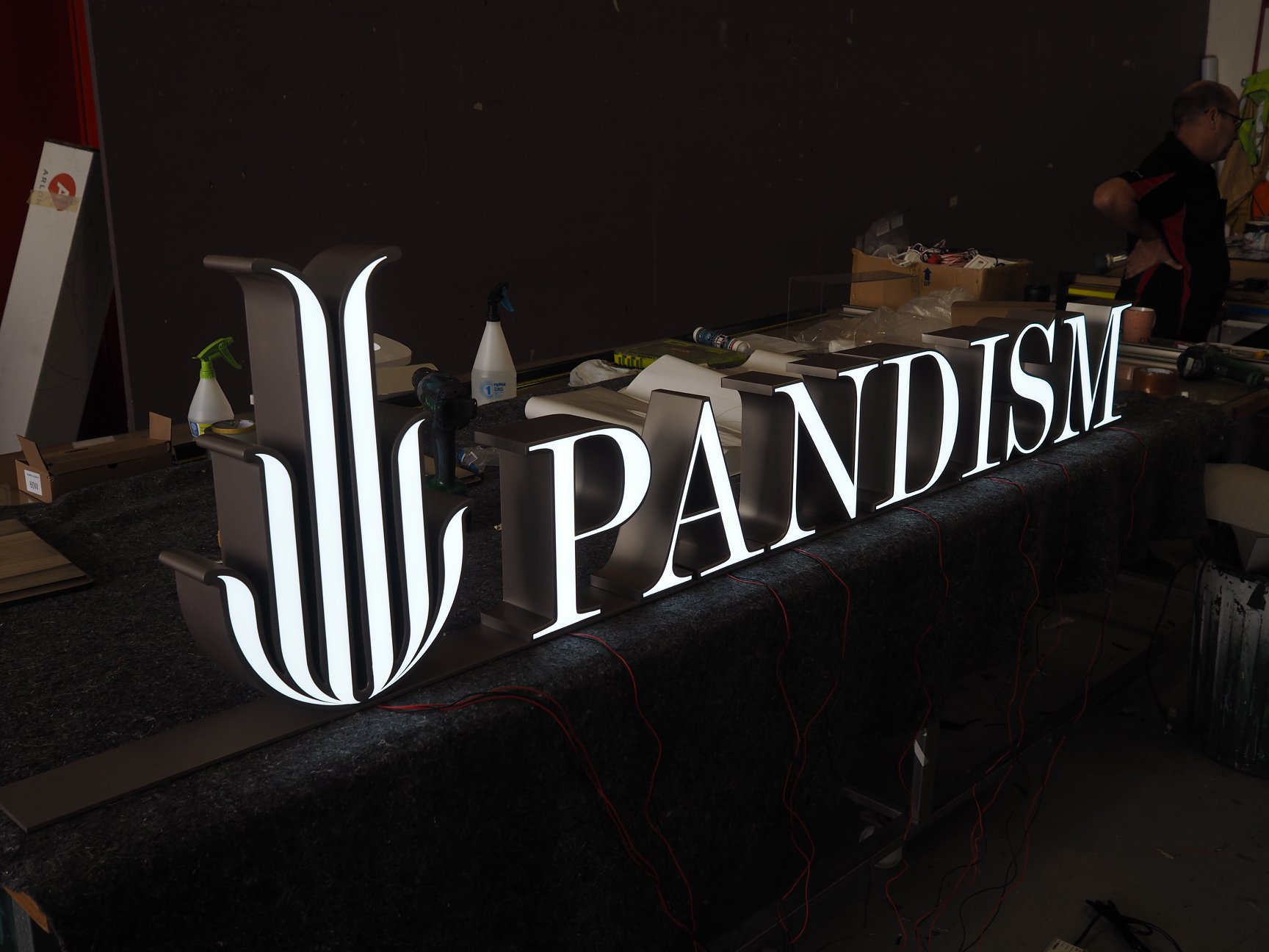 Testing and installing illuminated signage for Pandism