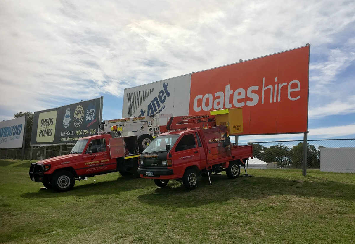 Installing the billboard for Mrs Mac's at Barbagello Raceway