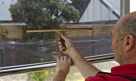 Apply the film to the glass