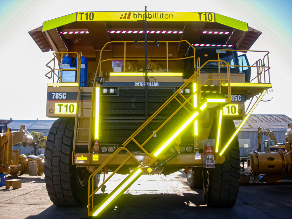 Reflective tape and fleet ID signage on a haul truck for BHP