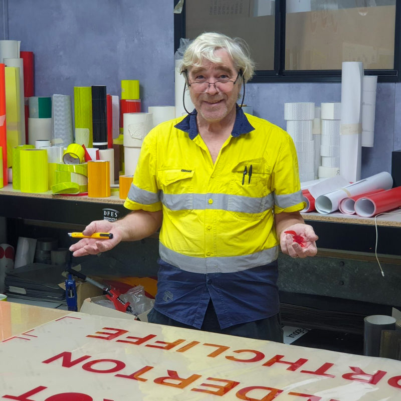 John works in our vinyl room and helps train the sign writers of the future.