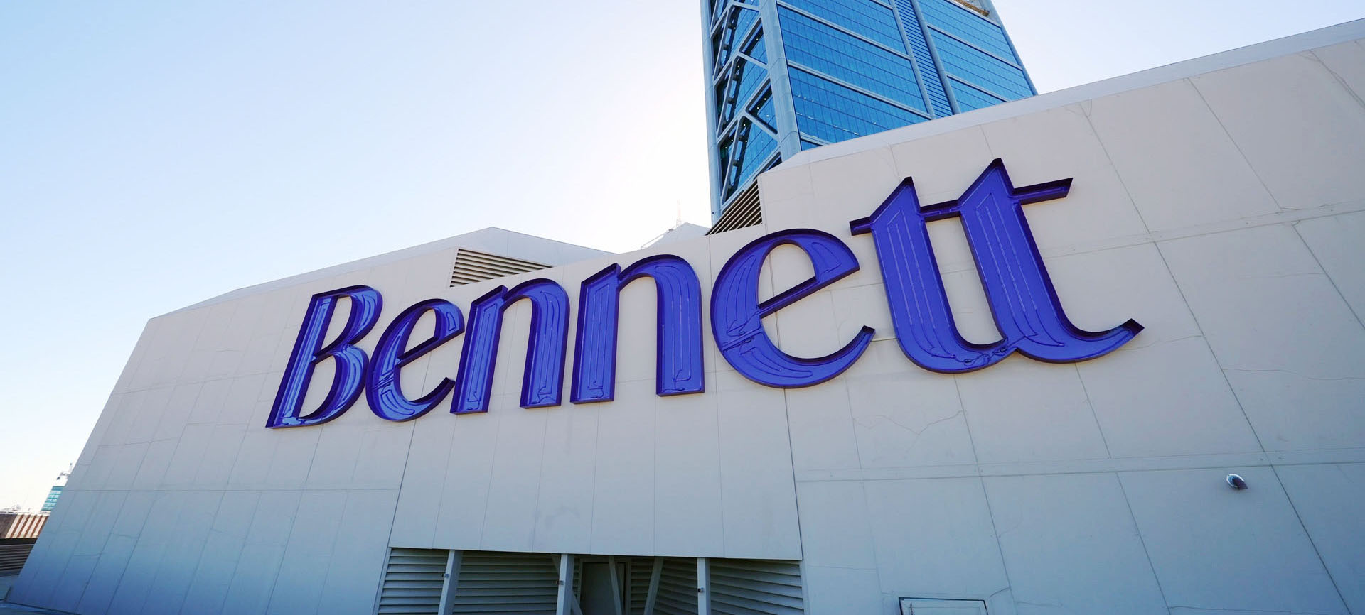 Large-scale illuminated signage installed on skyscraper for Bennett Litigation and Commercial Law in Perth.